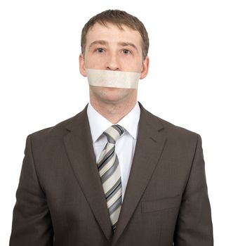 Businessman with tape over his mouth isolated on white background