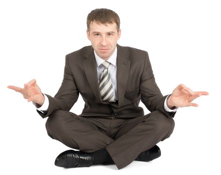 Businessman sitting in lotus posture and looking at camera isolated on white background