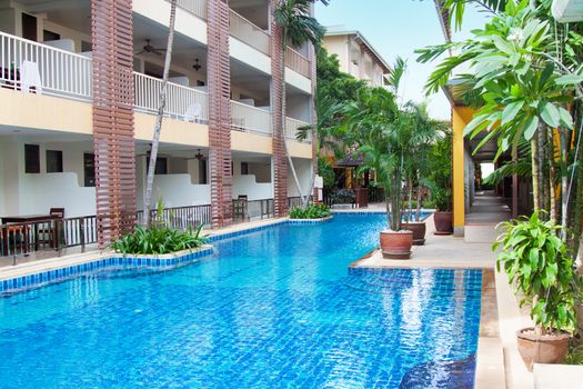 Bright photo with closeup of  poolside relax zone in Thailand