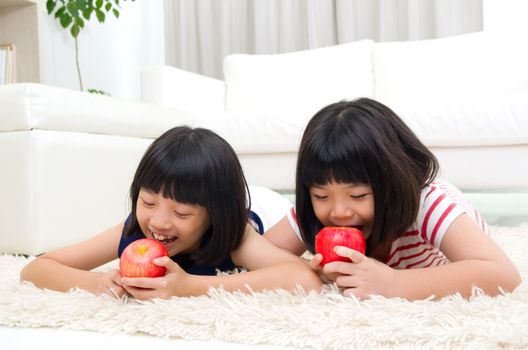 Lovely asian girls eating apple 