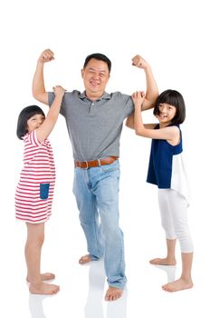 Asian father playing with his cute daughters. Fathers day concept.