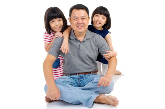 Asian father with his cute daughters. 