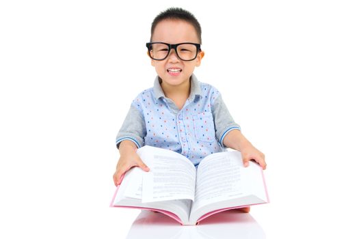 Asian boy sitting on the floor and reading

