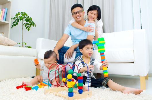 Asian family playing toys