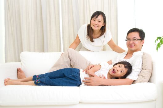 Indoor portrait of asian family