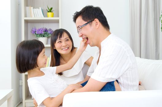 Asian family having fun at home