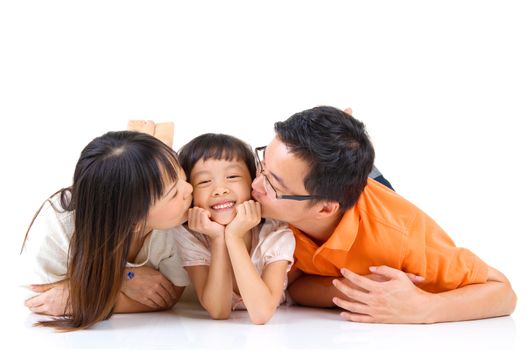 asian parent kissing their daughter