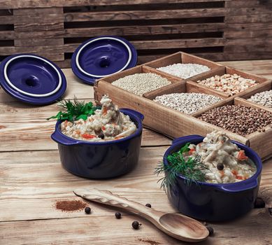 rice pilaf on the background wooden boxes with raw cereals in rustic style