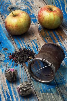 two red apple,strainer infuser tea of different varieties