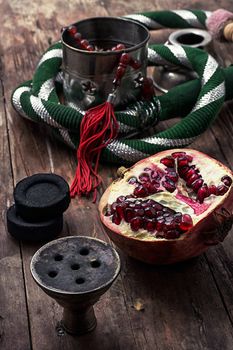 details Shisha and accessories on wooden background.image is tinted in vintage style