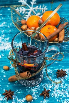 warming drink mulled wine on bright blue background.Photo tinted