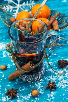 warming drink mulled wine on bright blue background.Photo tinted