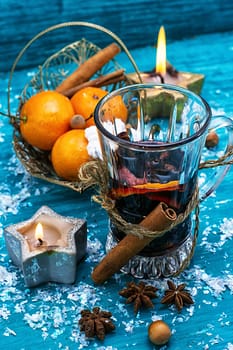 warming drink mulled wine on bright blue background.Photo tinted