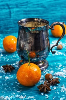 warming drink mulled wine on bright blue background.Photo tinted