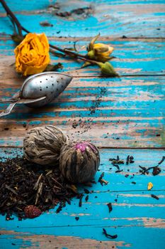 dried tea leaves for brewing tea on wooden table