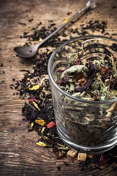 tea tea leaves scattered on the table in country style.Selective focus