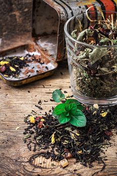 tea tea leaves scattered on the table in country style.Selective focus