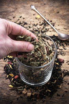 tea tea leaves scattered on the table in country style.Selective focus