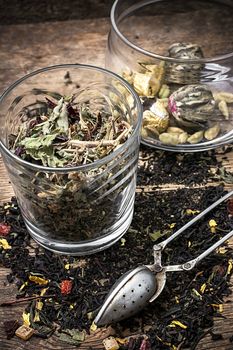 tea tea leaves scattered on the table in country style.Selective focus