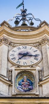 the famous Clock "Orologio" from Borromini's genius. At the bottom there is a mosaic "Madonna della Vallicella" from Pietro da Cortona