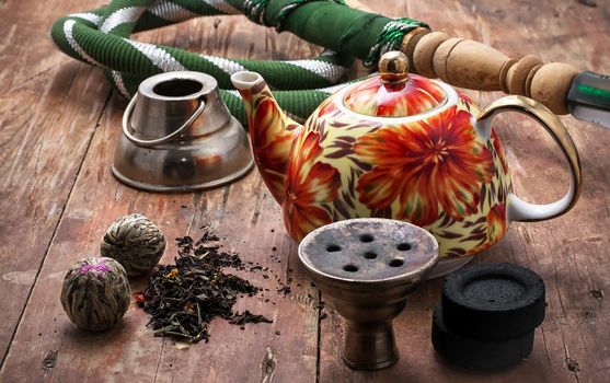 accessories to smoking hookah and dry tea leaves.Selective focus