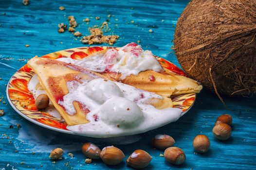 freshly baked waffle pecan coconut dessert with appendices ice cream .Shallow DOF