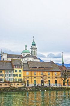 Waterfront and Saint Ursus Cathedral in Solothurn. Solothurn is the capital of Solothurn canton in Switzerland. It is located on the banks of Aare and on the foot of Weissenstein Jura mountains