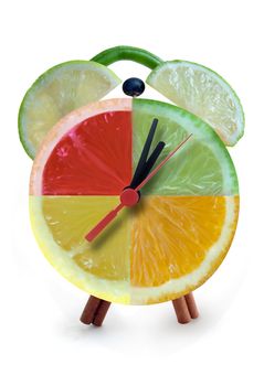 Clock made from citrus fruit and vegetables with clock hands 