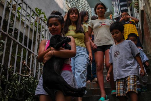 VENEZUELA, Caracas: Children exit their homes to allow for the extermination of Aedes mosquitoes carrying the Zika virus in the slums of Caracas, Venezuela on February 3, 2016. As of February 4, there have been reports of at least 255 cases of the rare Guillain-Barre syndrome  which causes the immune system to attack the nerves  potentially linked to the Zika virus in Venezuela.