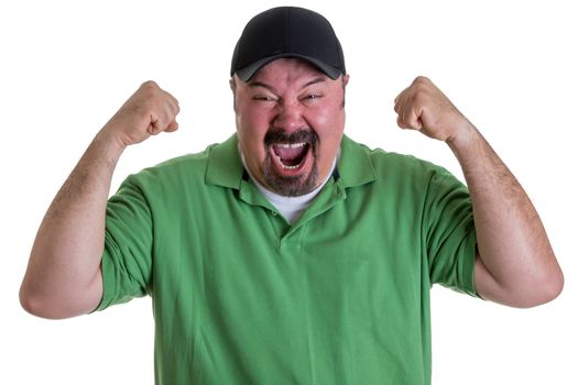 Waist Up of Excited Man with Goatee Wearing Green Shirt and Baseball Cap Holding Fists in Air and Celebrating Team Win in Studio with White Background