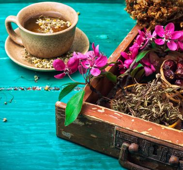 ceramic cup with tea brewed from dried chamomile and medicinal herbs.