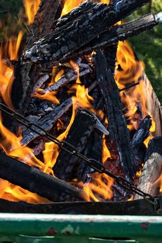 wood in the brazier flames.Selective focus