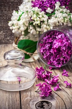 branches of blossoming lilac on wooden background.Selective focus