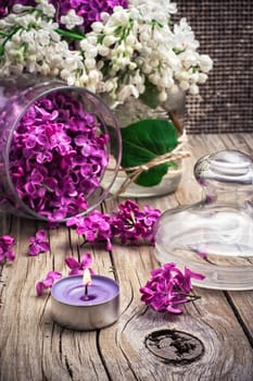 branches of blossoming lilac on wooden background.Selective focus