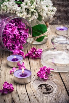 branches of blossoming lilac on wooden background.Selective focus