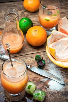 freshly squeezed citrus juice from oranges and tangerines.Selective focus