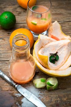 orange tangerine juice on the background of the rind in the rural style