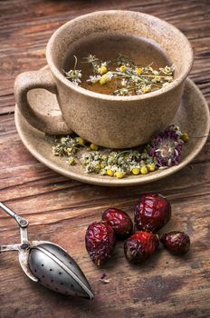 fragrant chamomile tea and briar in rustic style