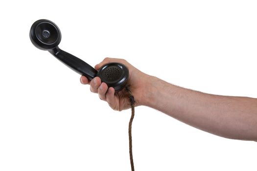 Male hand holding retro landline telephone, nearly broken cable