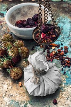 assembled the dried yield healing herbs traditional medicine and ceramic mortar.Photo tinted