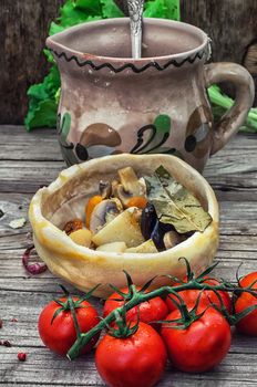 vegetable hot plate made of baked dough on wooden countertop.Photo tinted