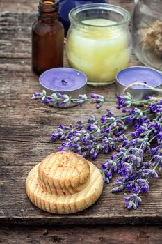 candles,flowers lavender oil for Spa treatments on wooden background.Photo tinted.Selective focus