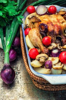 chicken baked with mushrooms,potatoes and vegetables in glass form