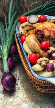 chicken baked with mushrooms,potatoes and vegetables in glass form