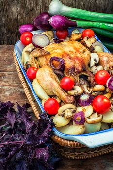 chicken baked with mushrooms,potatoes and vegetables in glass form