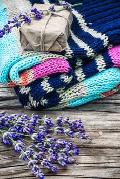 pure wool sweaters mothproof sprigs of lavender and scented soap.Photo tinted.Selective focus