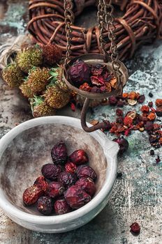 assembled the dried yield healing herbs traditional medicine and ceramic mortar.Photo tinted.Selective focus