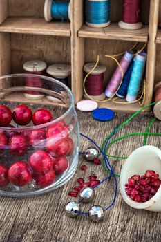 different tools for needlework beading and sewing in vintage style.Selective focus