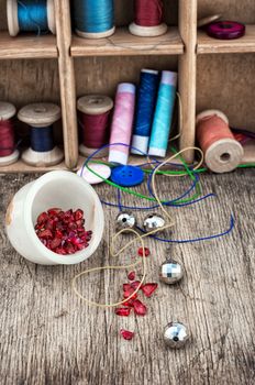 different tools for needlework beading and sewing in vintage style.Selective focus