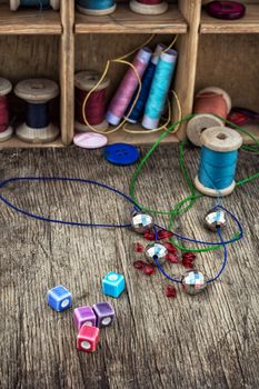 different tools for needlework beading and sewing in vintage style.Selective focus